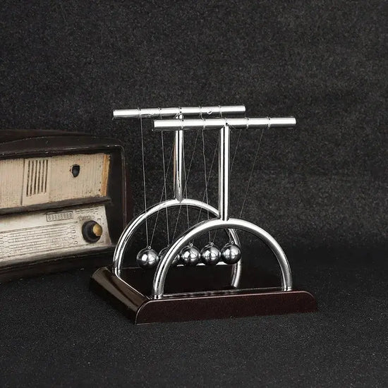 Pendolo di Newton, bilancia, sfera d&