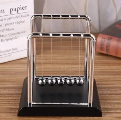 Pendolo di Newton, bilancia, sfera d&