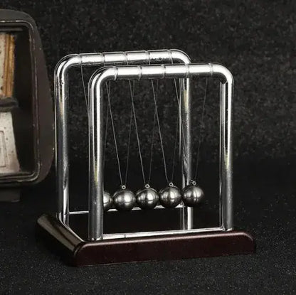 Pendolo di Newton, bilancia, sfera d&